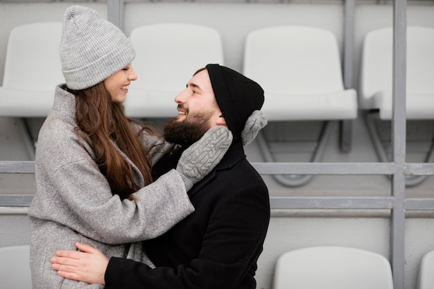 Young couple hugging on bench