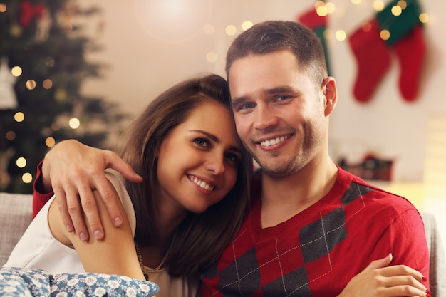 young couple hugging in Christmas time