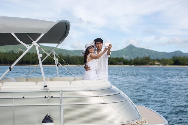 Young couple is traveling on a yacht in the Indian ocean