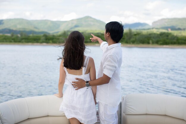 Young couple is traveling on a yacht in the Indian ocean