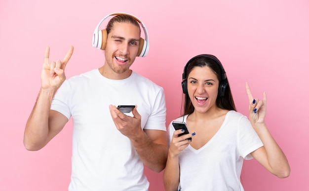 Young Couple over isolated background