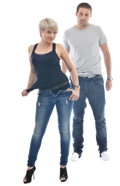 Photo young couple isolated on white in fashionable underwear and blue jeans clothing