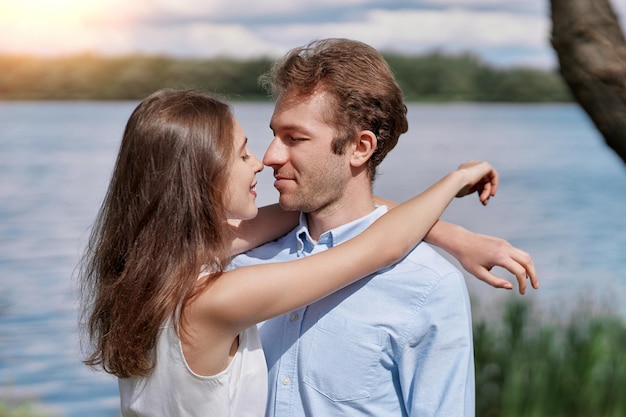 Young couple kisses during a country walk