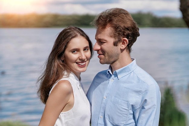 Young couple kisses during a country walk