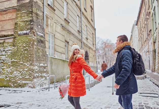 Young couple kissing at wintertime outdoors