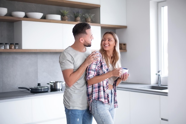 Young couple in the kitchen in good morning