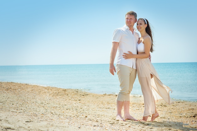 A young couple in love on the beach