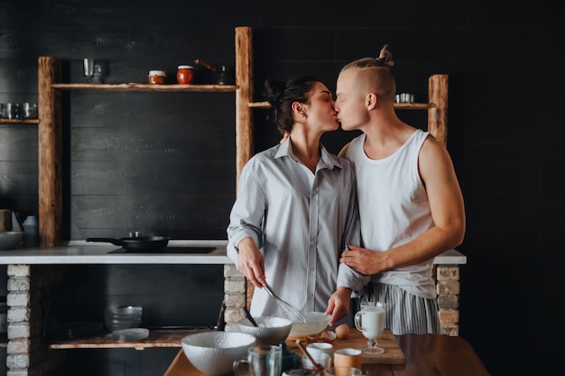 Young couple in love cook healthy food in the kitchen together 