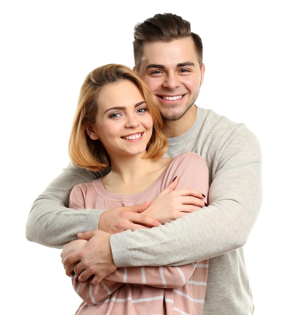 Young couple in love embracing isolated on white