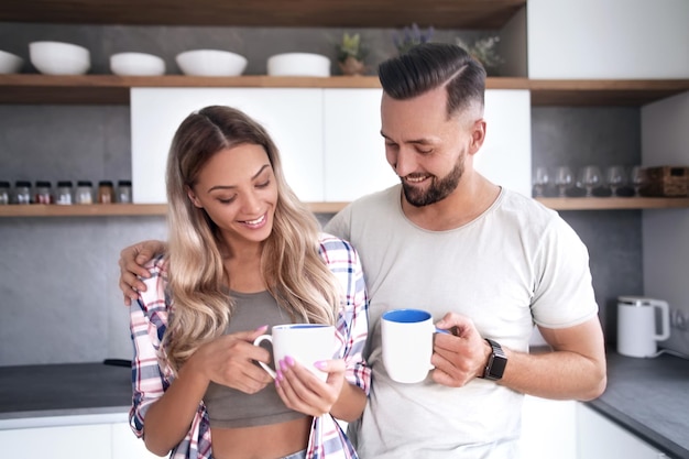 Young couple in love in the kitchen in a good morning