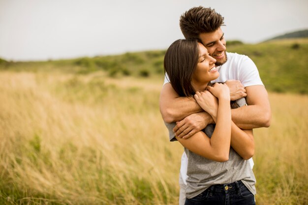 Young couple in love outside in spring nature