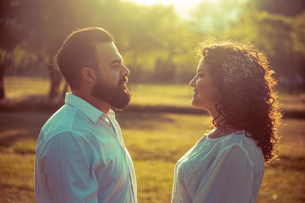 Young couple in love in a park outdoors