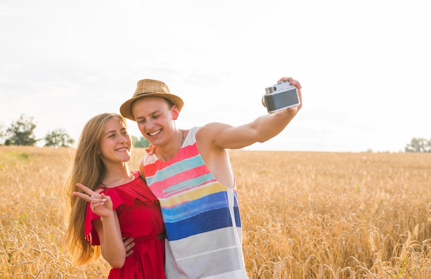 Young couple in love taking selfie outdoors