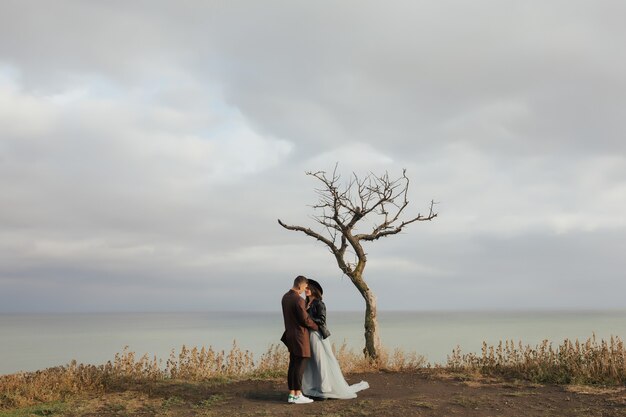 young couple in love together near the sea