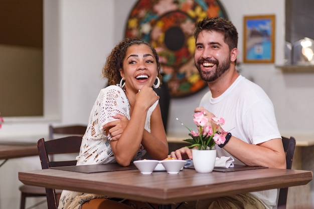 Young couple of lovers having dinner at the restaurant.