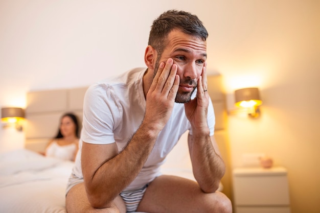 Young couple lying in bed frustrated thinking about relationships