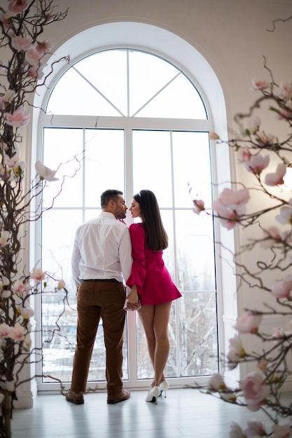 Photo young couple man and woman together in a light interior wedding