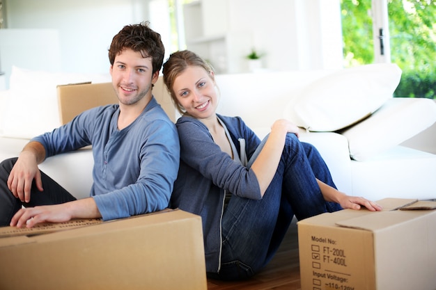 Young couple moving in their home