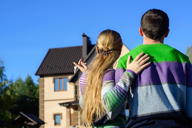 Young couple near his house