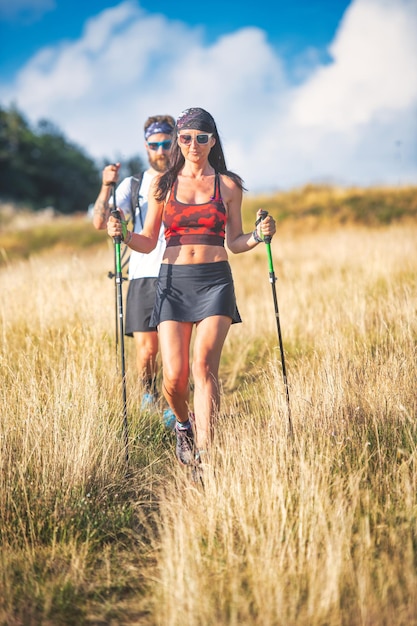 Young couple during a Nordic walking hike