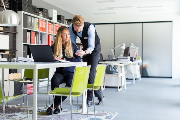 Young couple in office