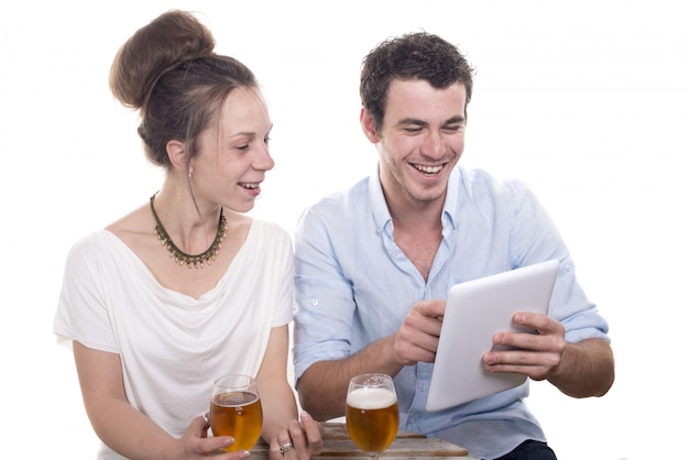 Young couple playing with a digital tablet