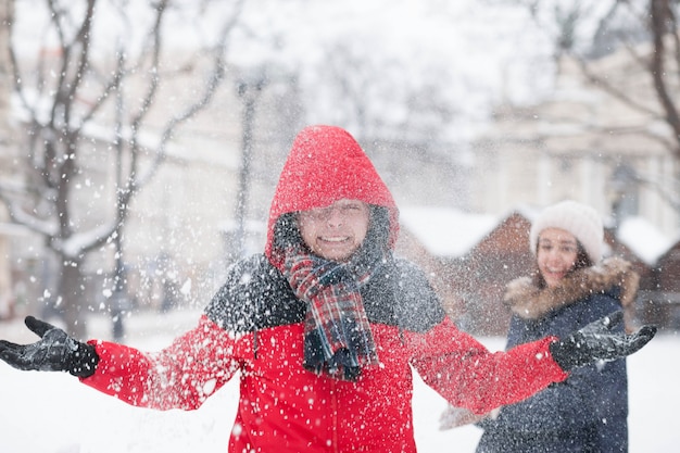 Young couple playing with snow