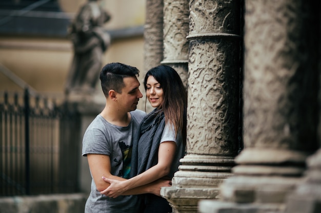 young couple posing on city background, travel concept