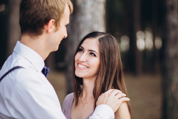 a young couple posing in nature