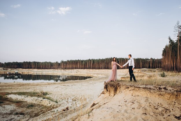 a young couple posing in nature