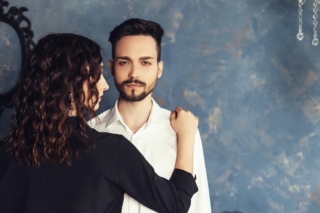 Young couple posing in studio