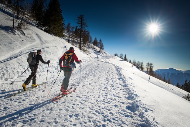 Young couple practicing ski on the mountain