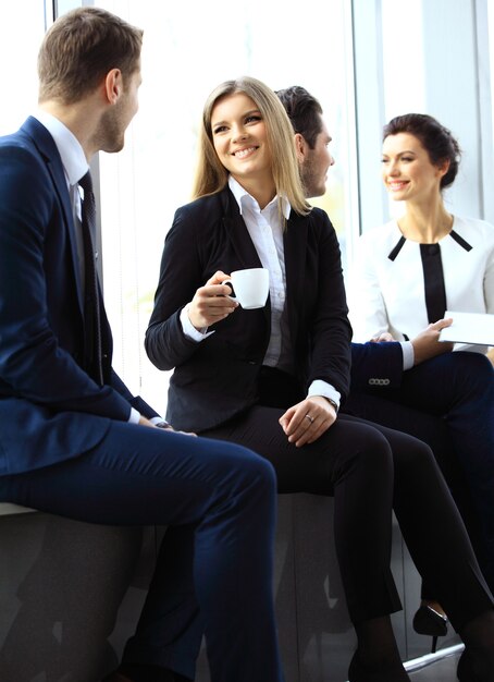 Young couple of professionals chatting during a coffee break