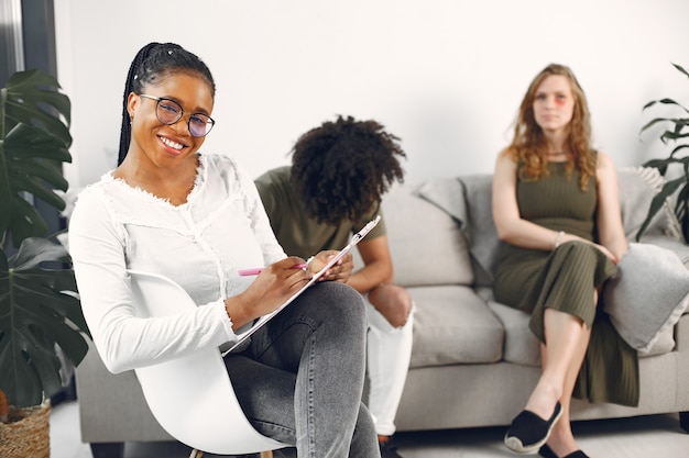 Young couple at psychologist.
Discussing relationship problems with their therapist.