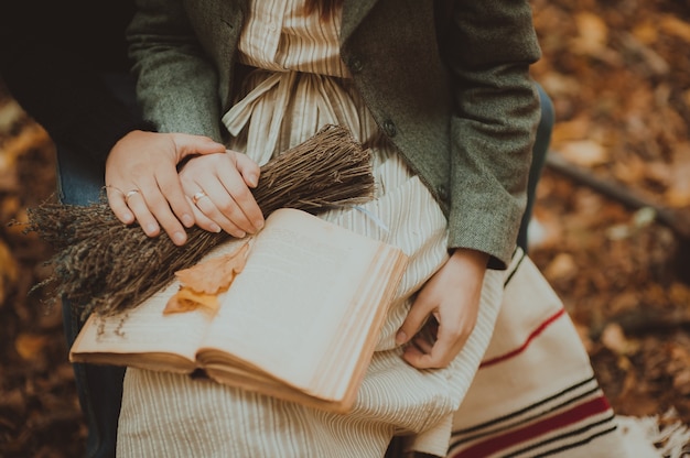 Young couple reading book in the park