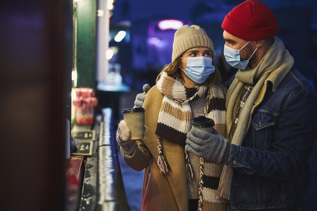 Young couple relaxing in city during pandemic