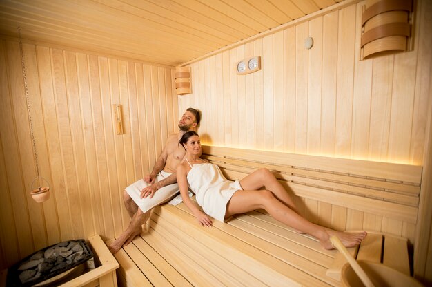 Young couple relaxing in the sauna