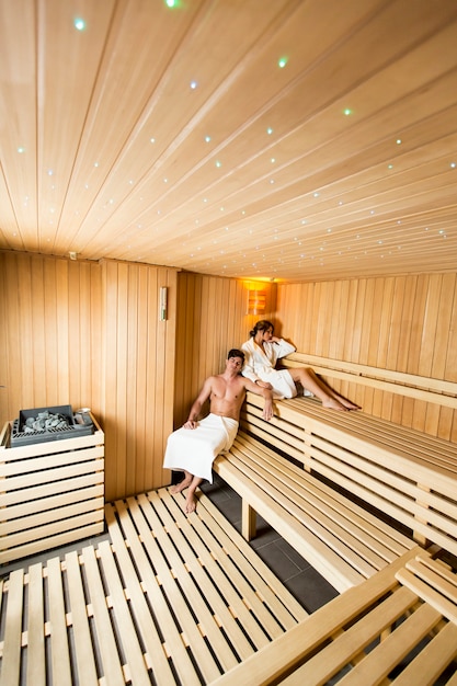 Young couple relaxing in the sauna