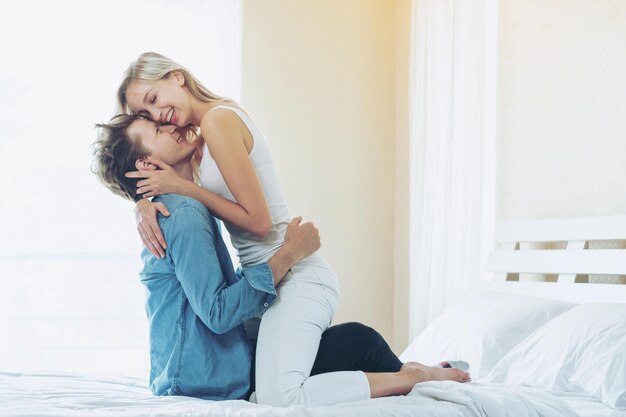Premium Photo Young couple romantic moment on the bed in bedroom picture