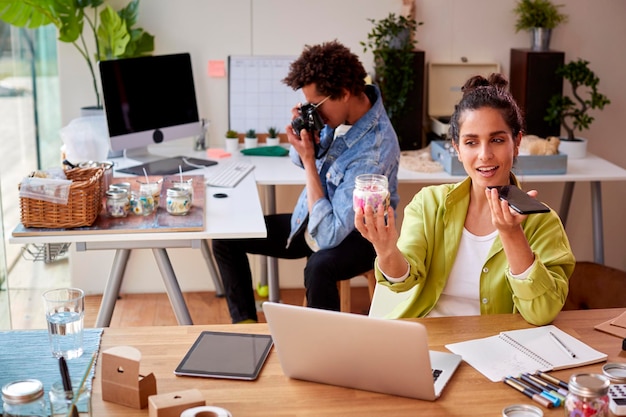 Young Couple Running Online Business Making Boutique Candles And Taking Photos For Online Marketing