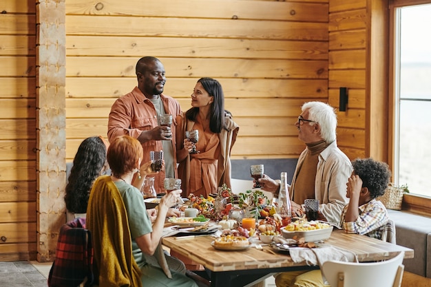 Young couple saying the toast at dinner