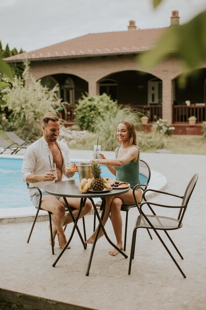 Young couple sitting in the backyard