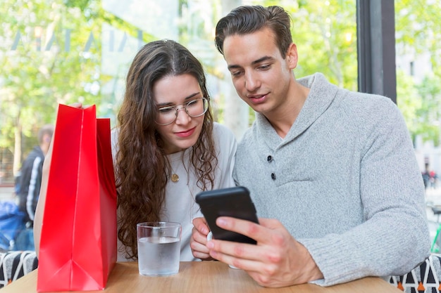 Young couple sitting at cafe