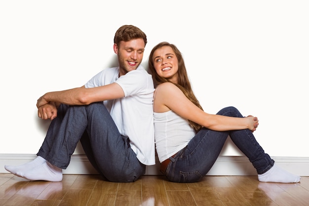 Young couple sitting on floor