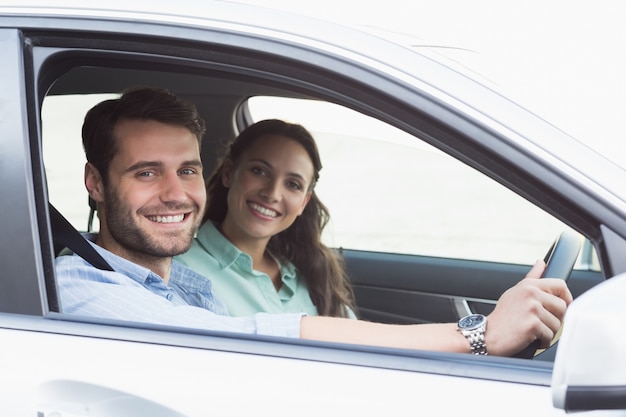 Young couple smiling at the camera