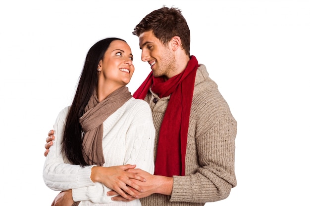 Young couple smiling and hugging