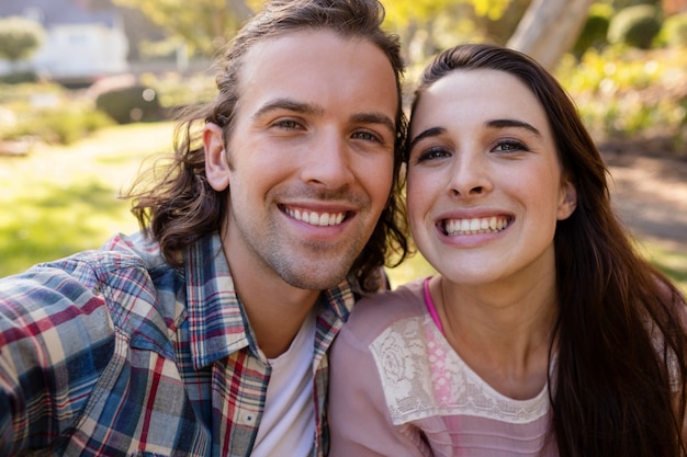 Young couple smiling in park