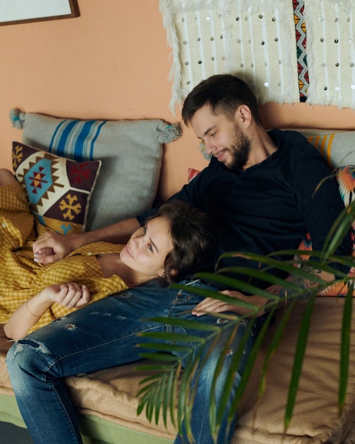 Young couple on the sofa in love.