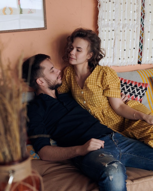 Young couple on the sofa in love.