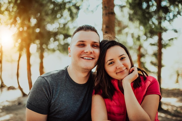 The young couple spend time together in the forest